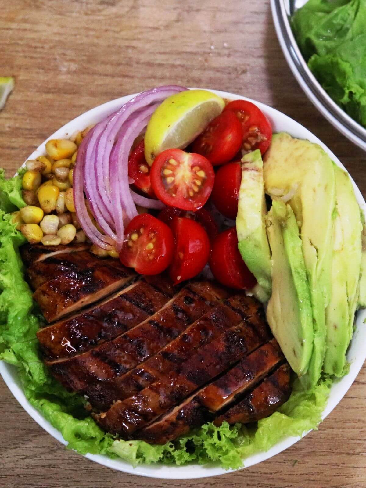 close-up of grilled chicken rice bowl.