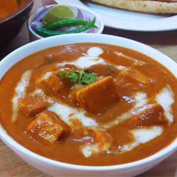 close-up of paneer butter masala in a bowl.