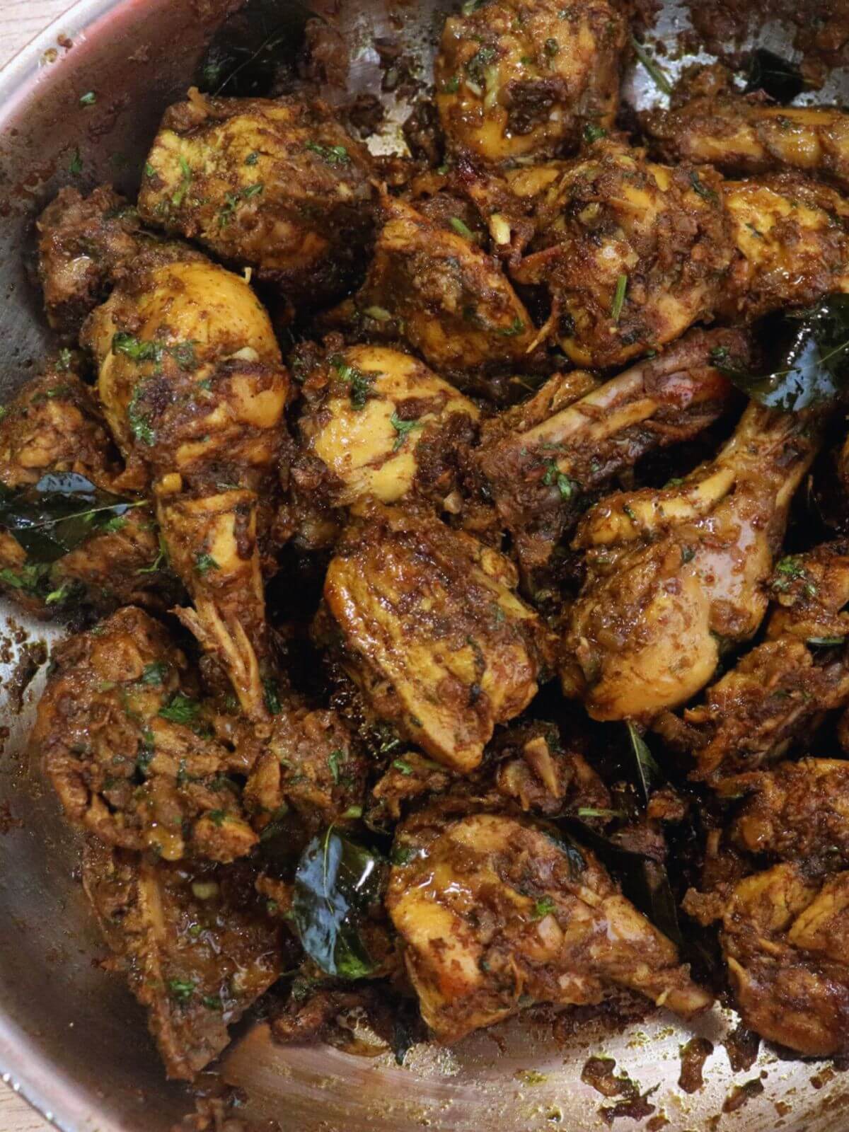 close-up of pepper chicken in a skillet.