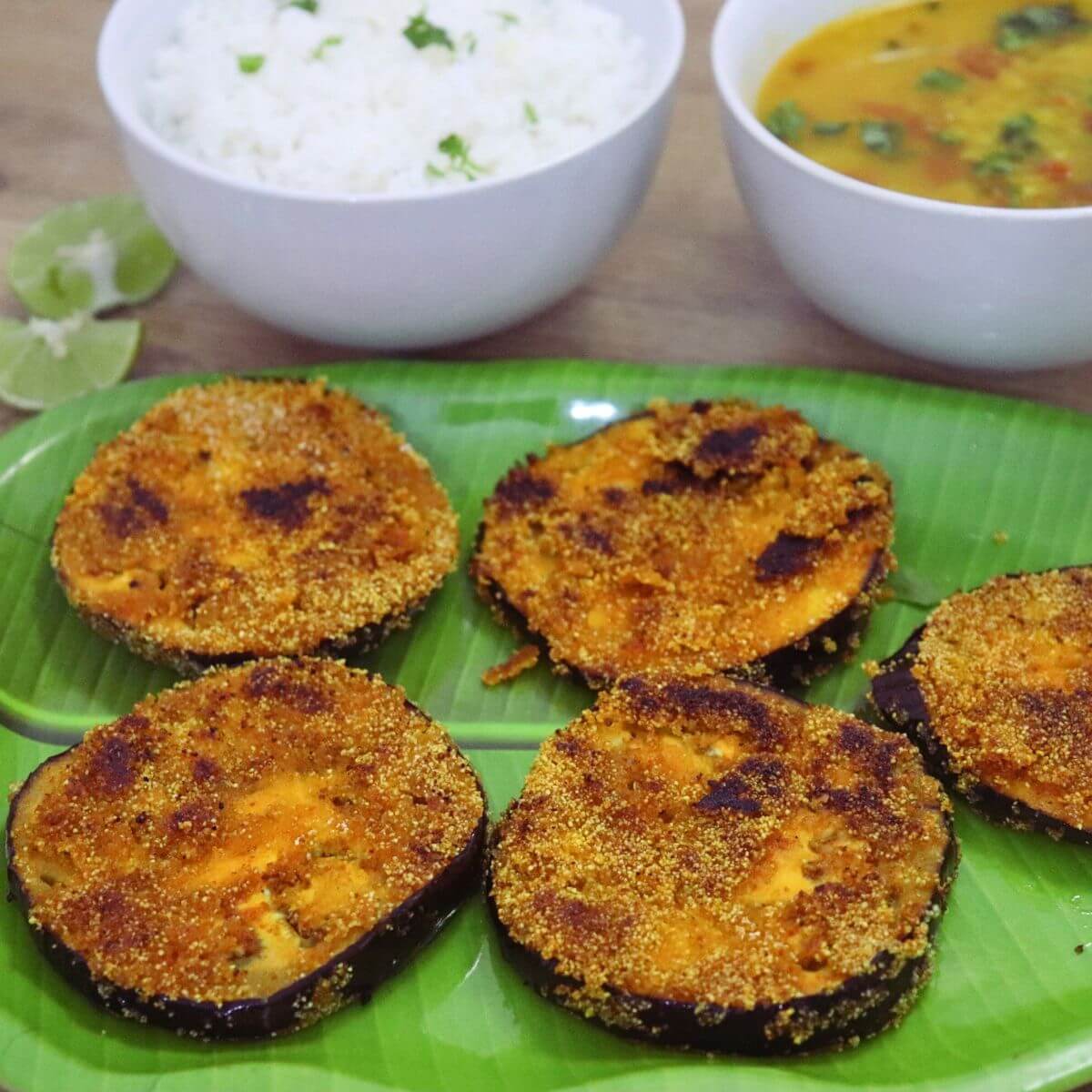 close-up of brinjal fry served in a plate.