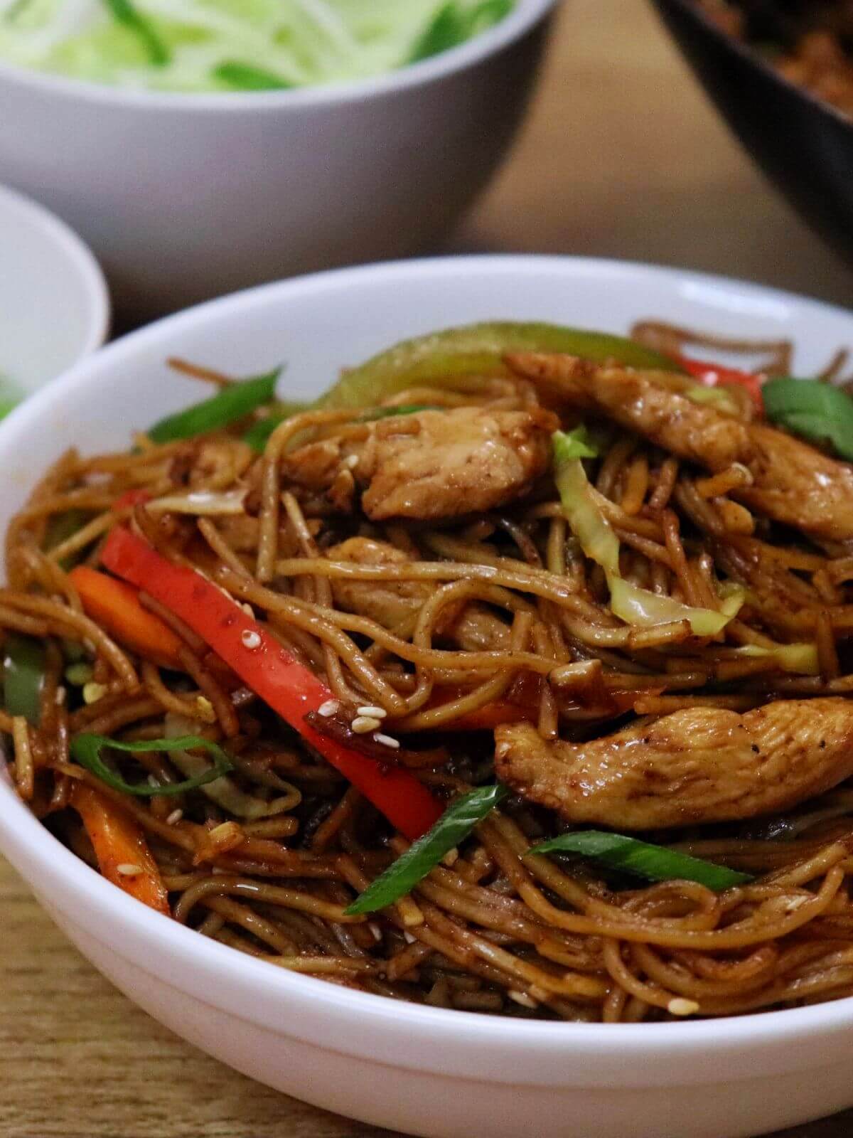 close-up of chicken chow mein served in a bowl.