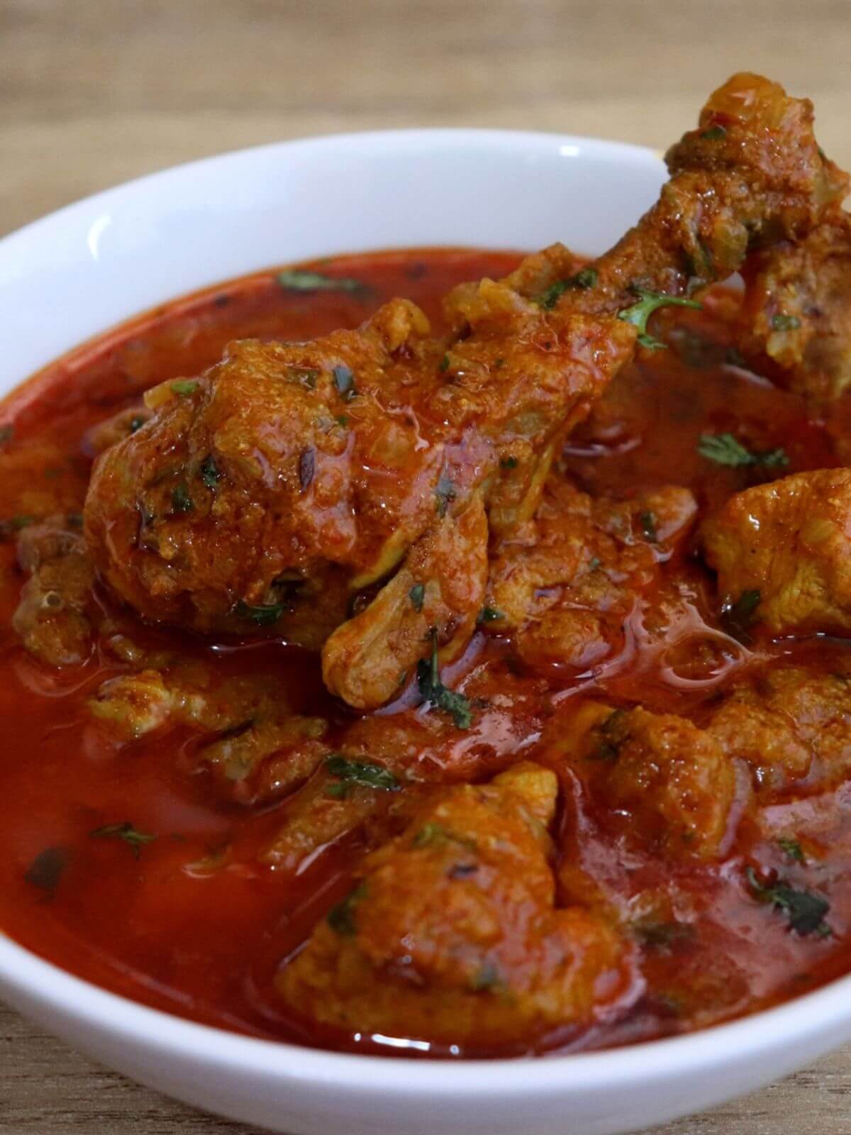close-up of pressure cooker chicken curry in a bowl.