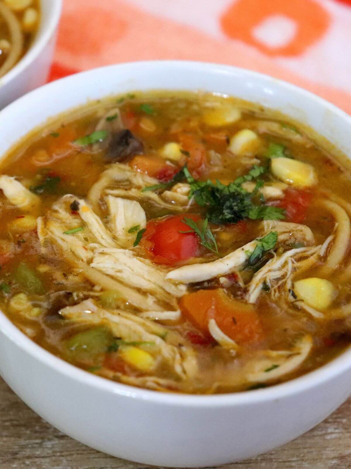 close-up of chicken noodle soup in a bowl.