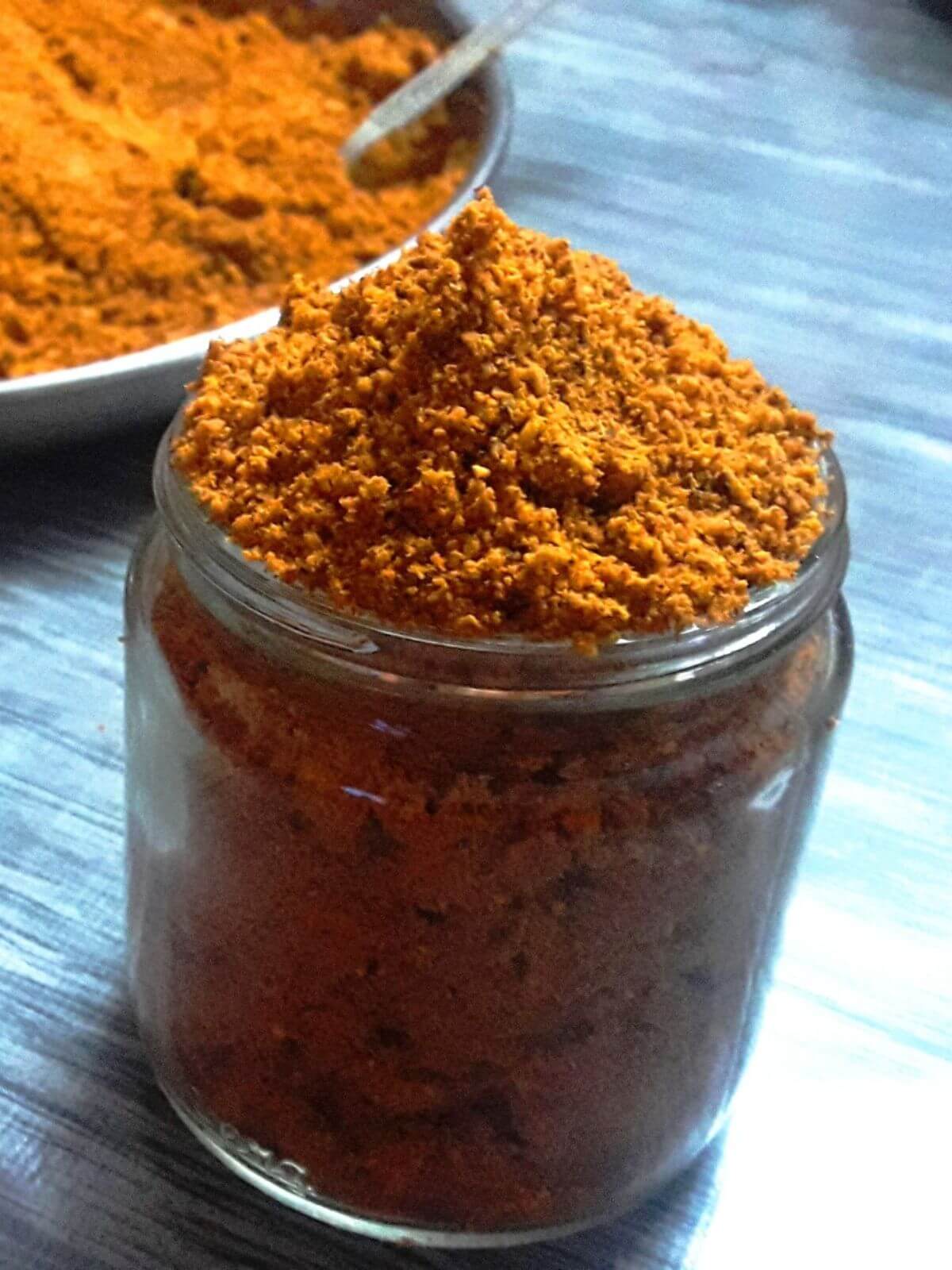 close-up of chutney powder in a small jar.