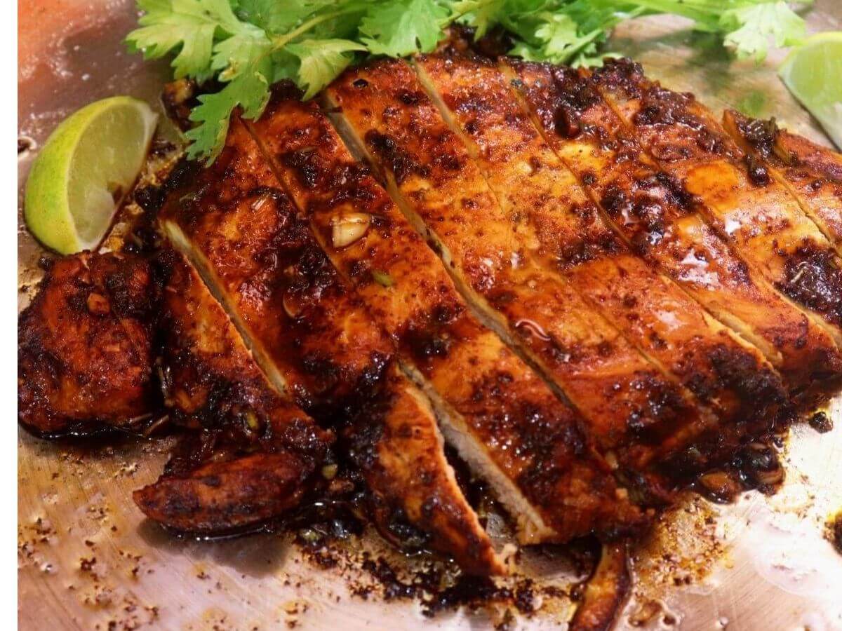 Close-up of sliced cilantro lime chicken in a skillet.