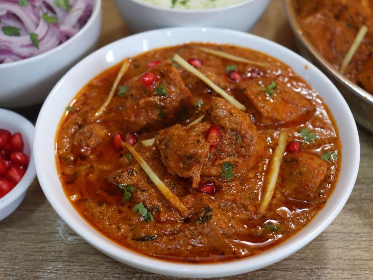 close-up of dishooms chicken ruby served in a white bowl.