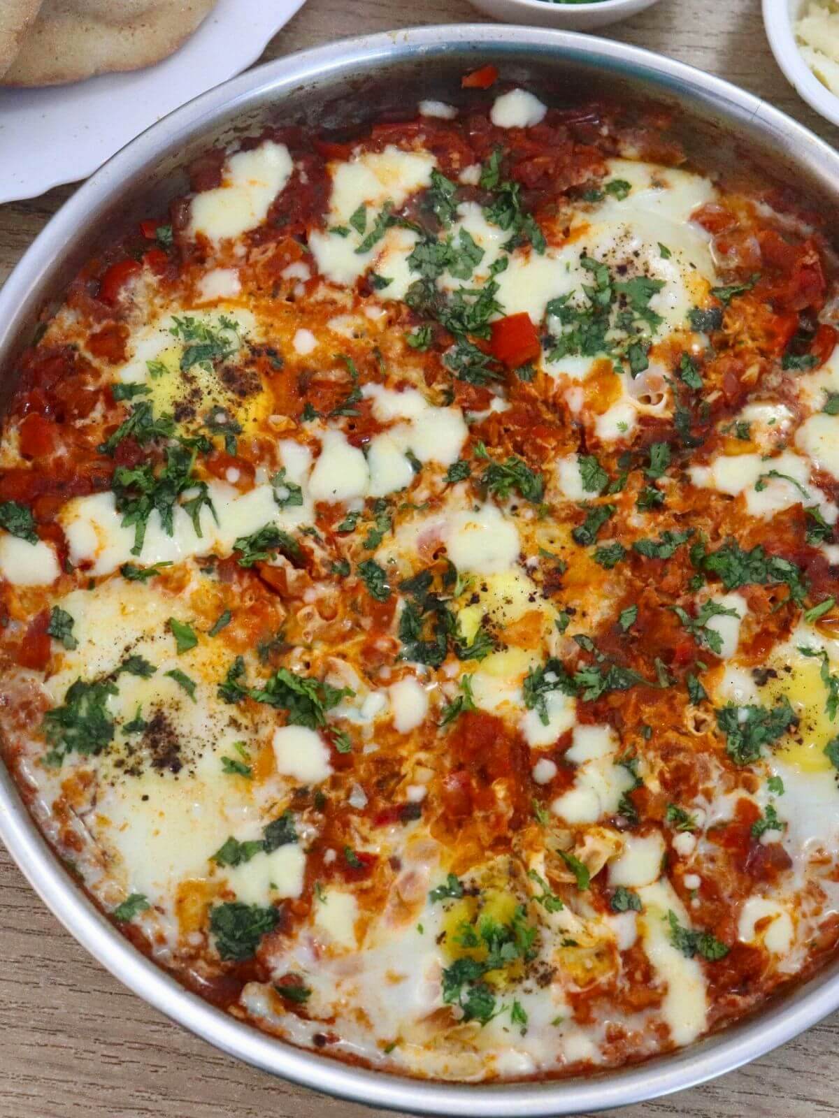 close-up of mediterranean shakshuka in a skillet.