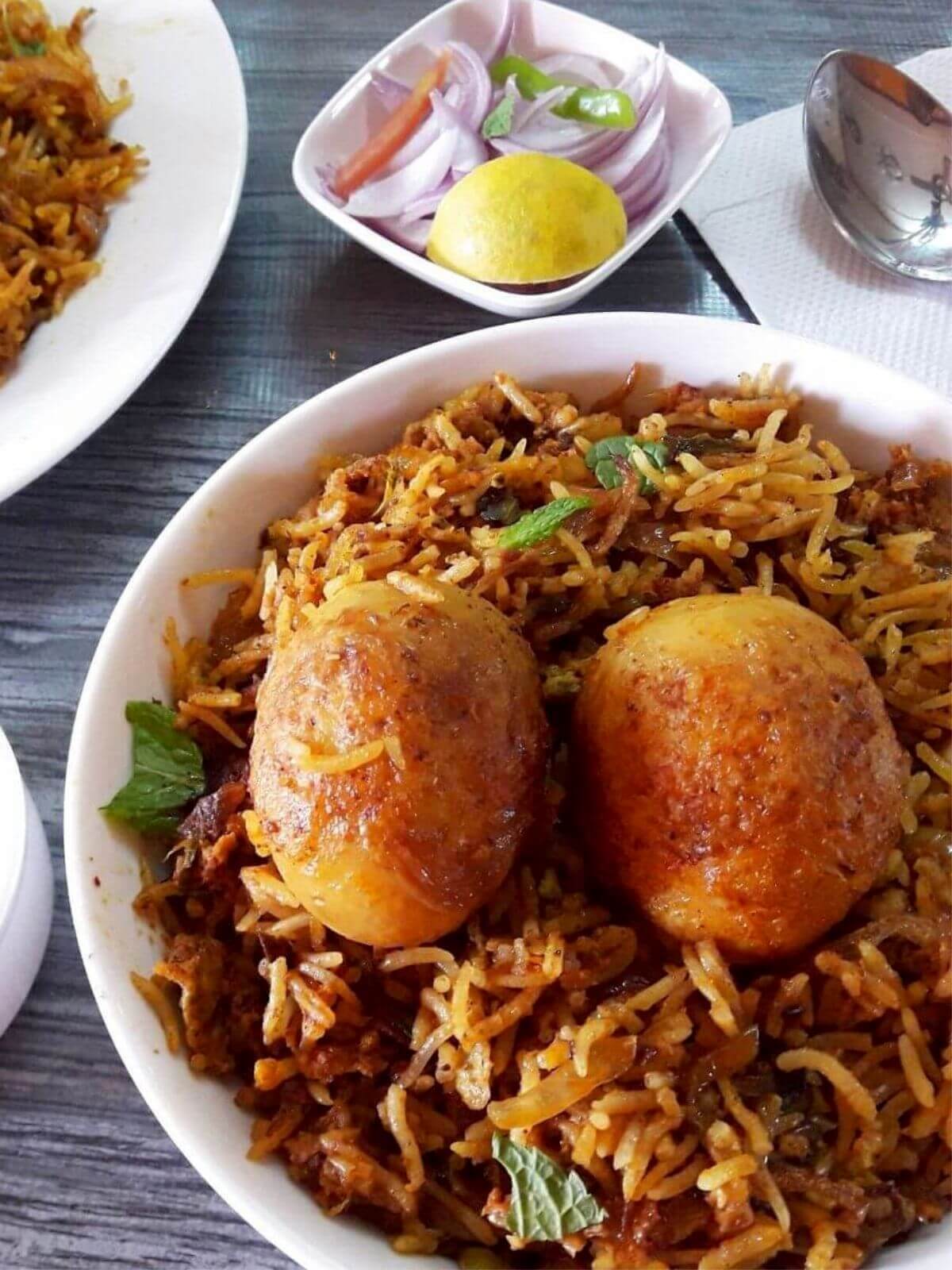 close-up of egg biryani in pressure cooker.