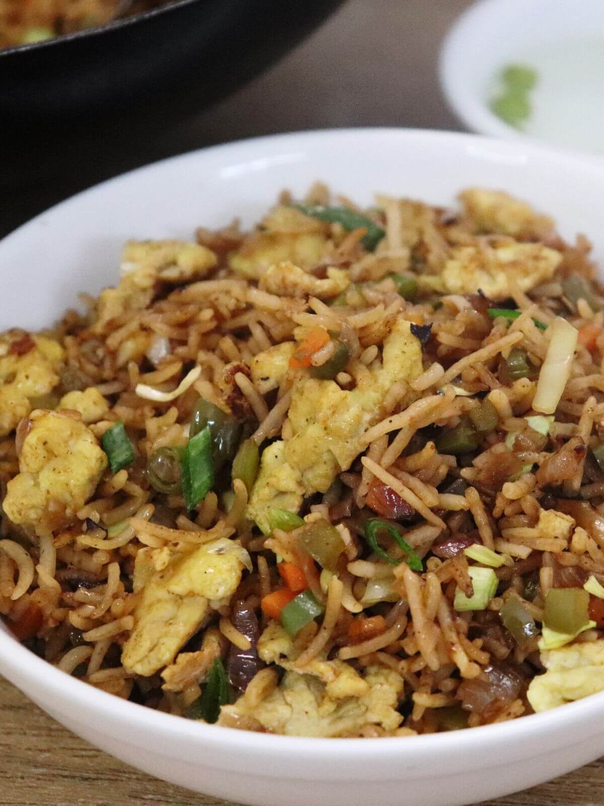 close-up of egg fried rice recipe in a bowl.