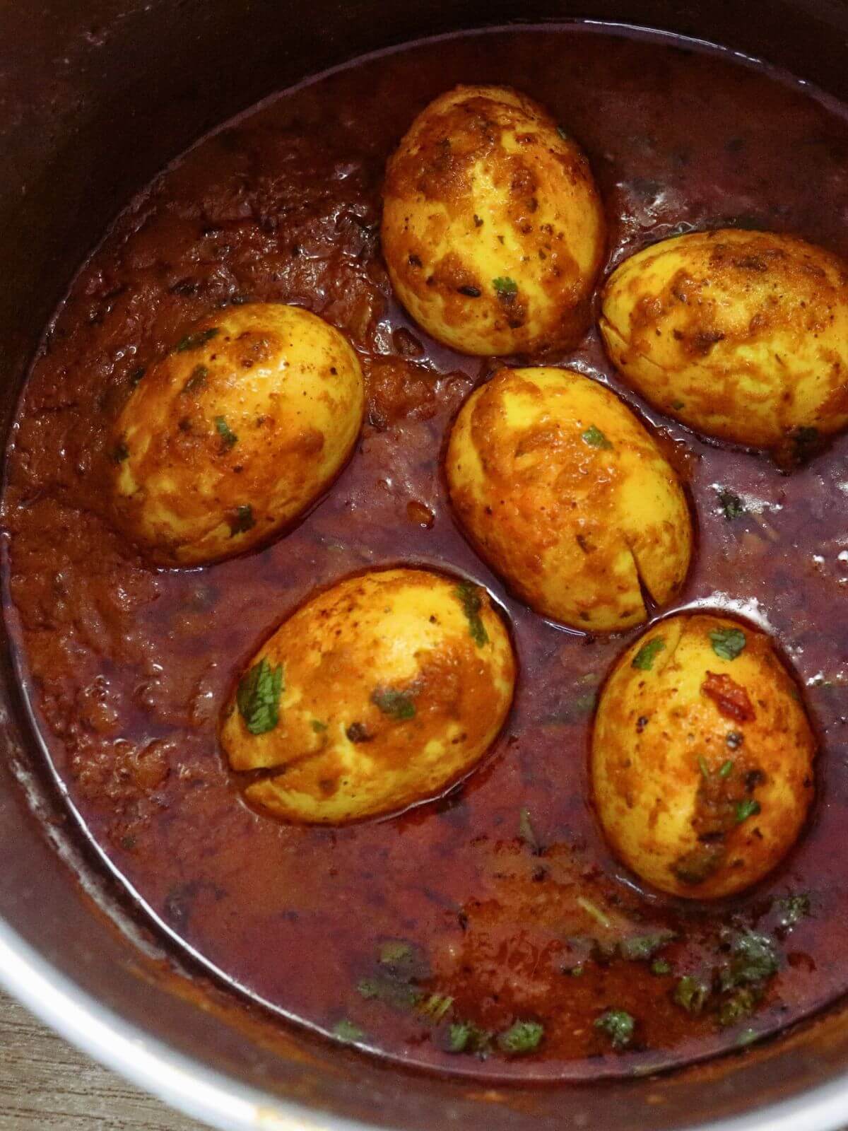 close-up of egg masala curry in a pot.