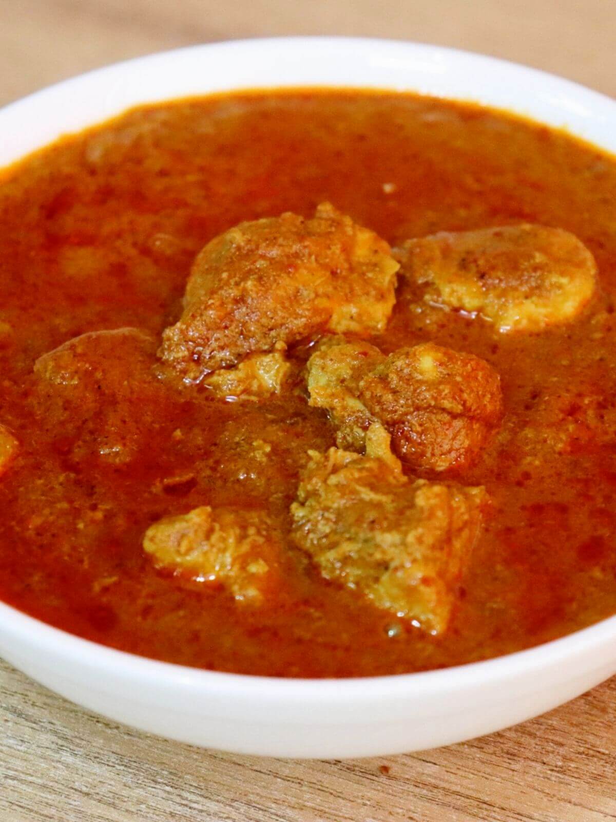 close-up of gavran chicken curry in a bowl.