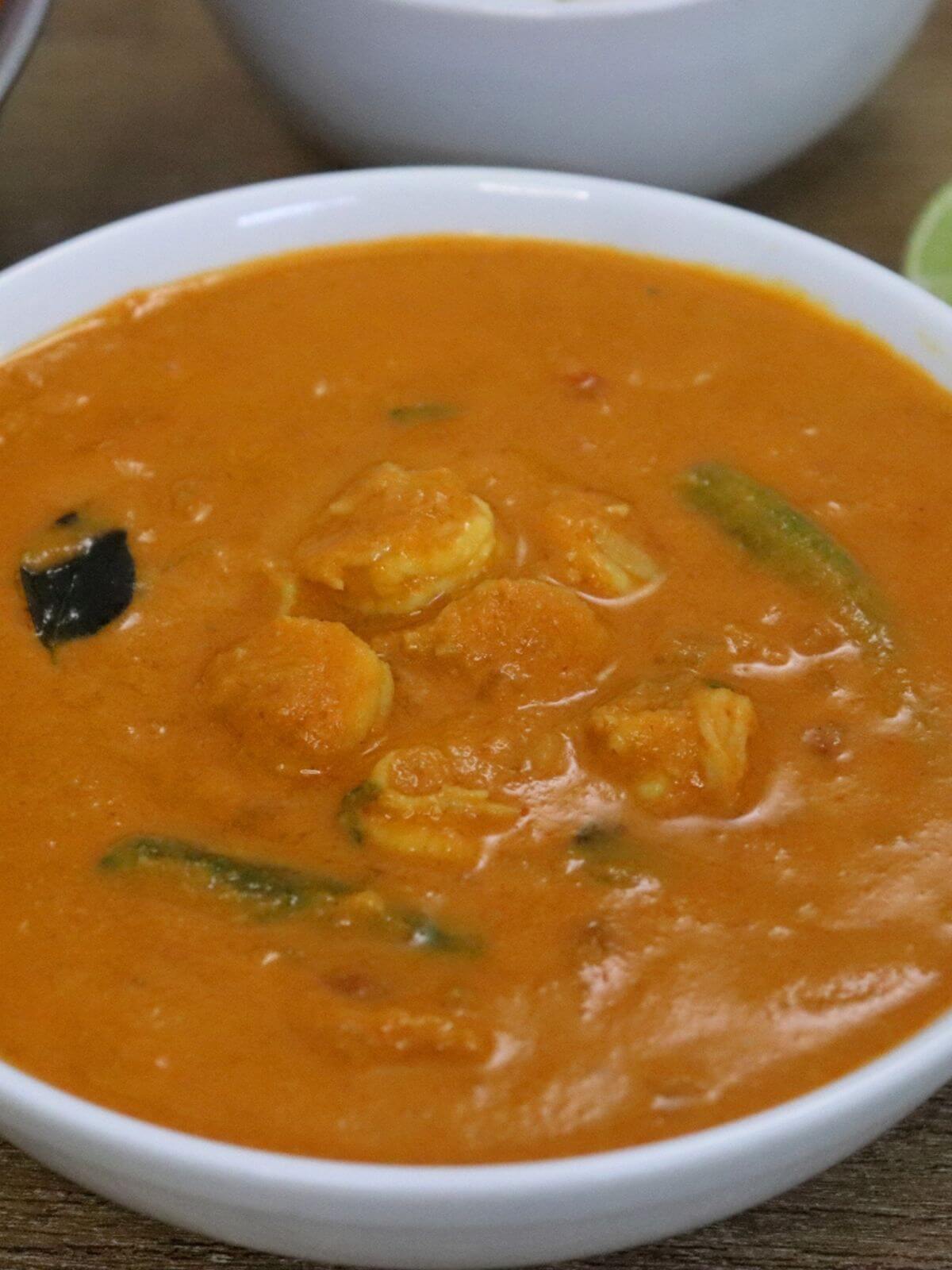 close-up of goan prawn curry recipe served in a white bowl.