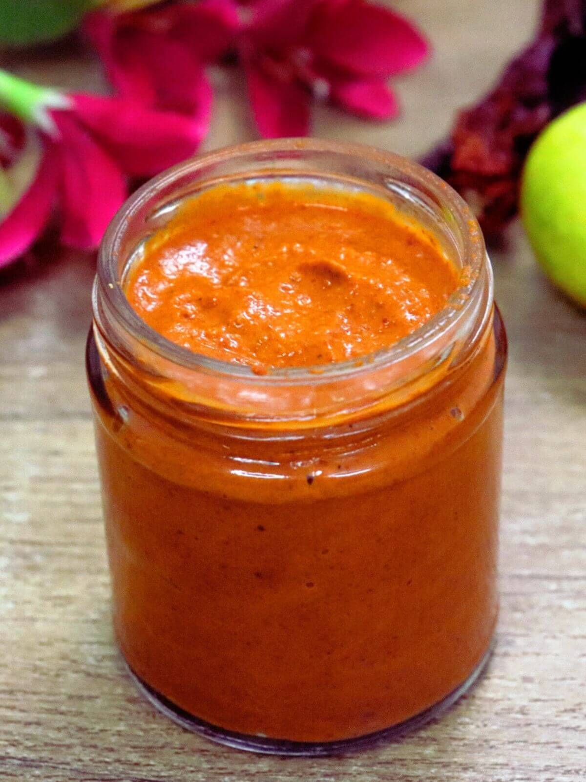 Homemade harissa paste in a glass jar.