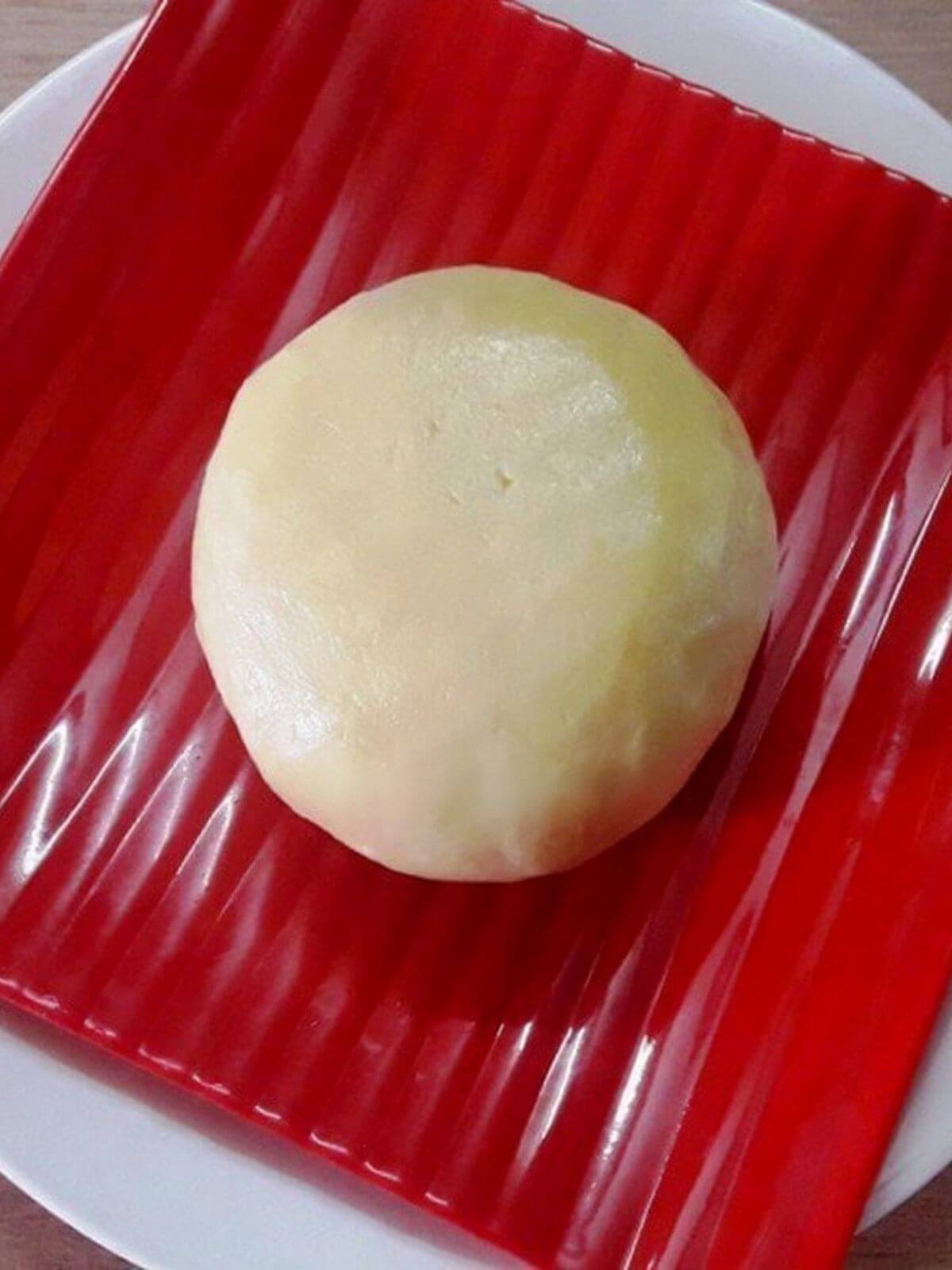 close-up of instant mawa or khoya served on a plate.