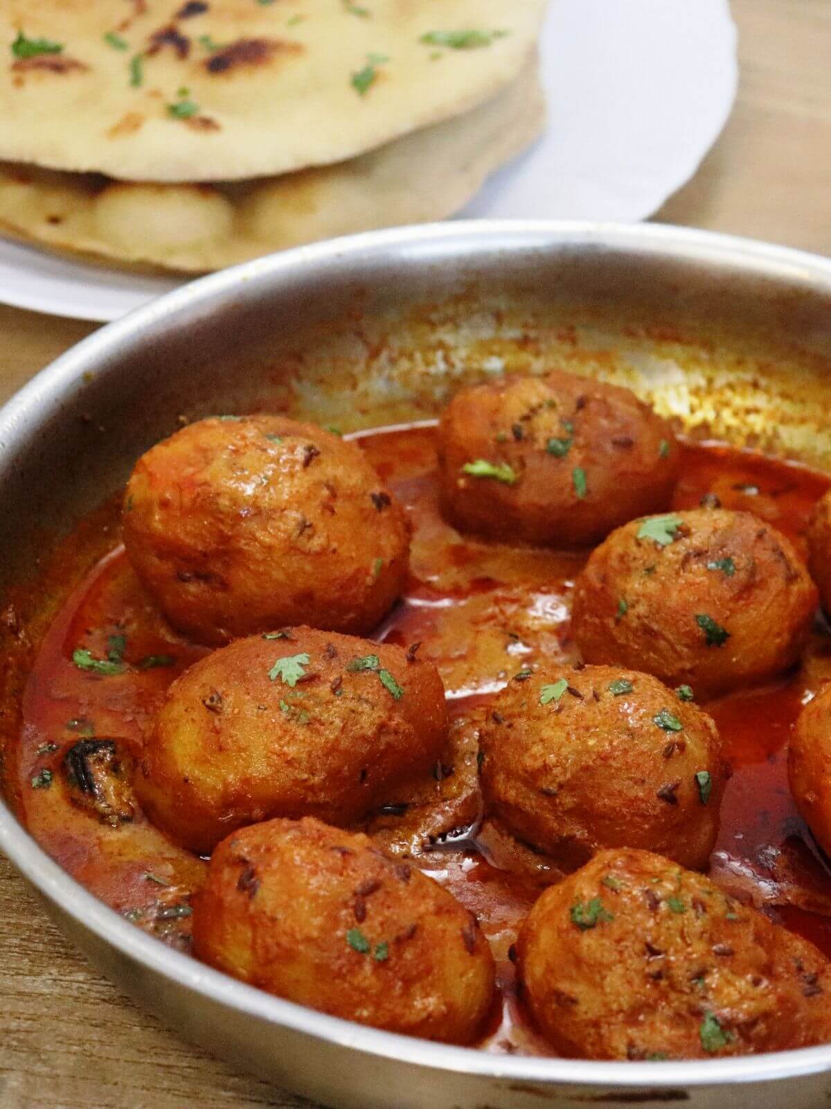close-up of kashmiri dum aloo in a skillet.