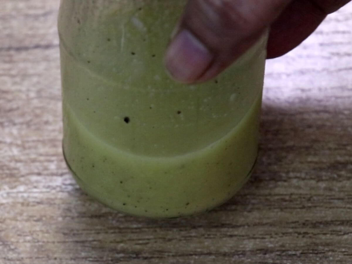lemon vinaigrette dressing in a mason jar.