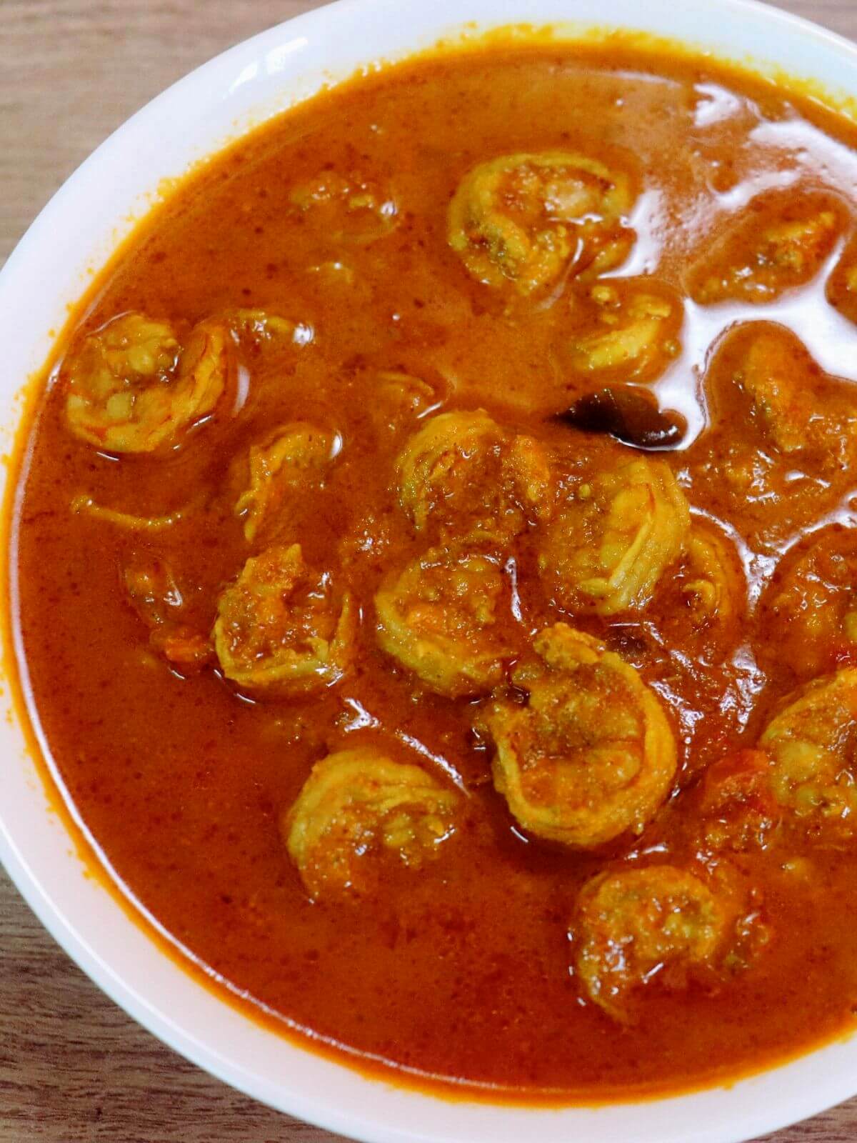 close-up of maharashtrian prawn curry served in a bowl.