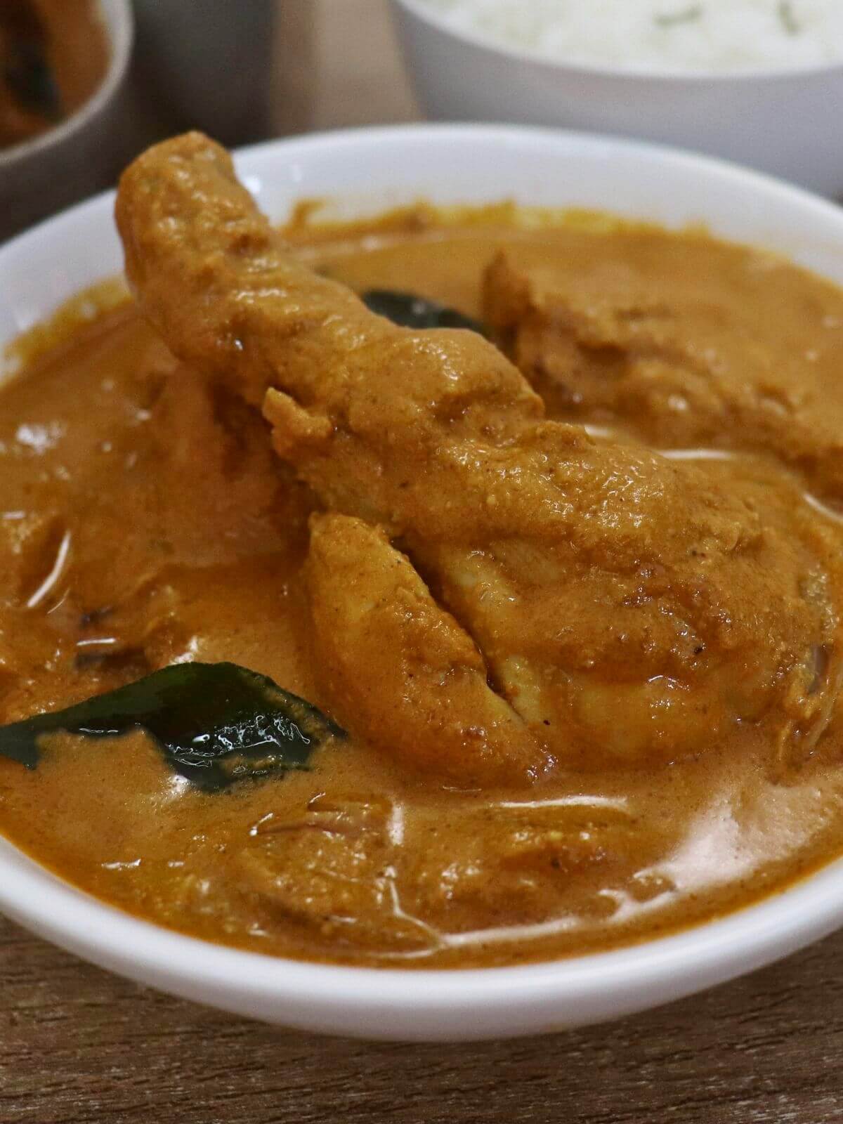 close-up of mangalorean chicken curry served in a bowl.