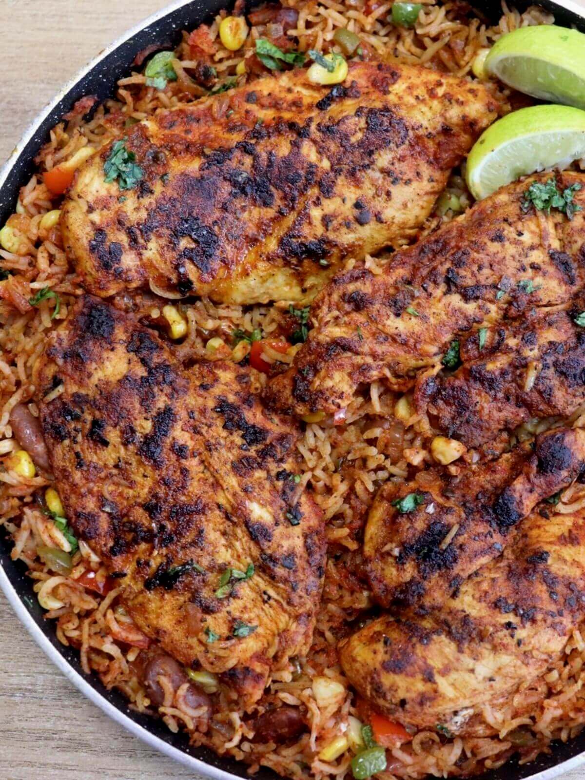 close-up of mexican chicken and rice in a pan.