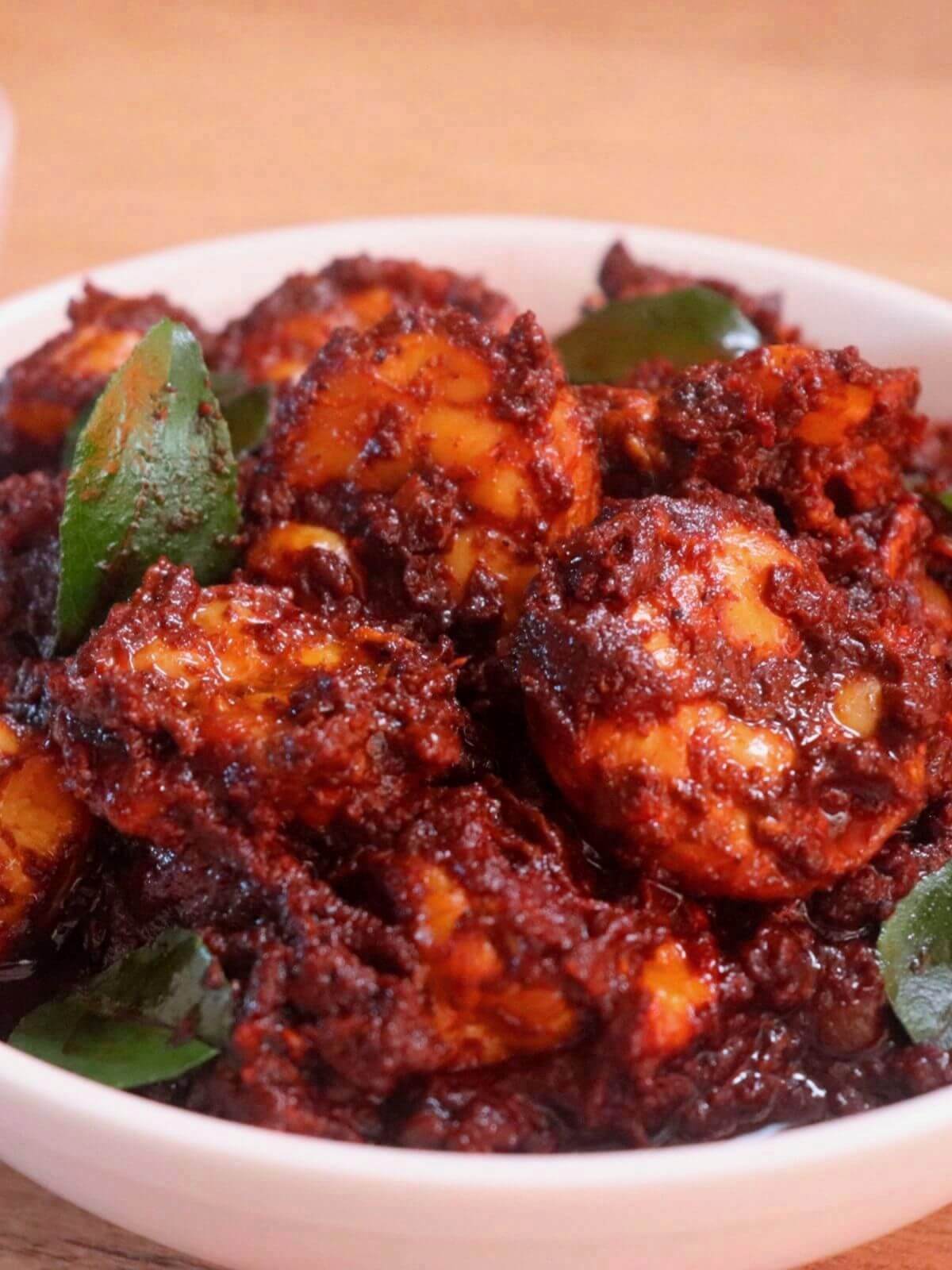 close-up of prawn ghee roast served in a bowl.