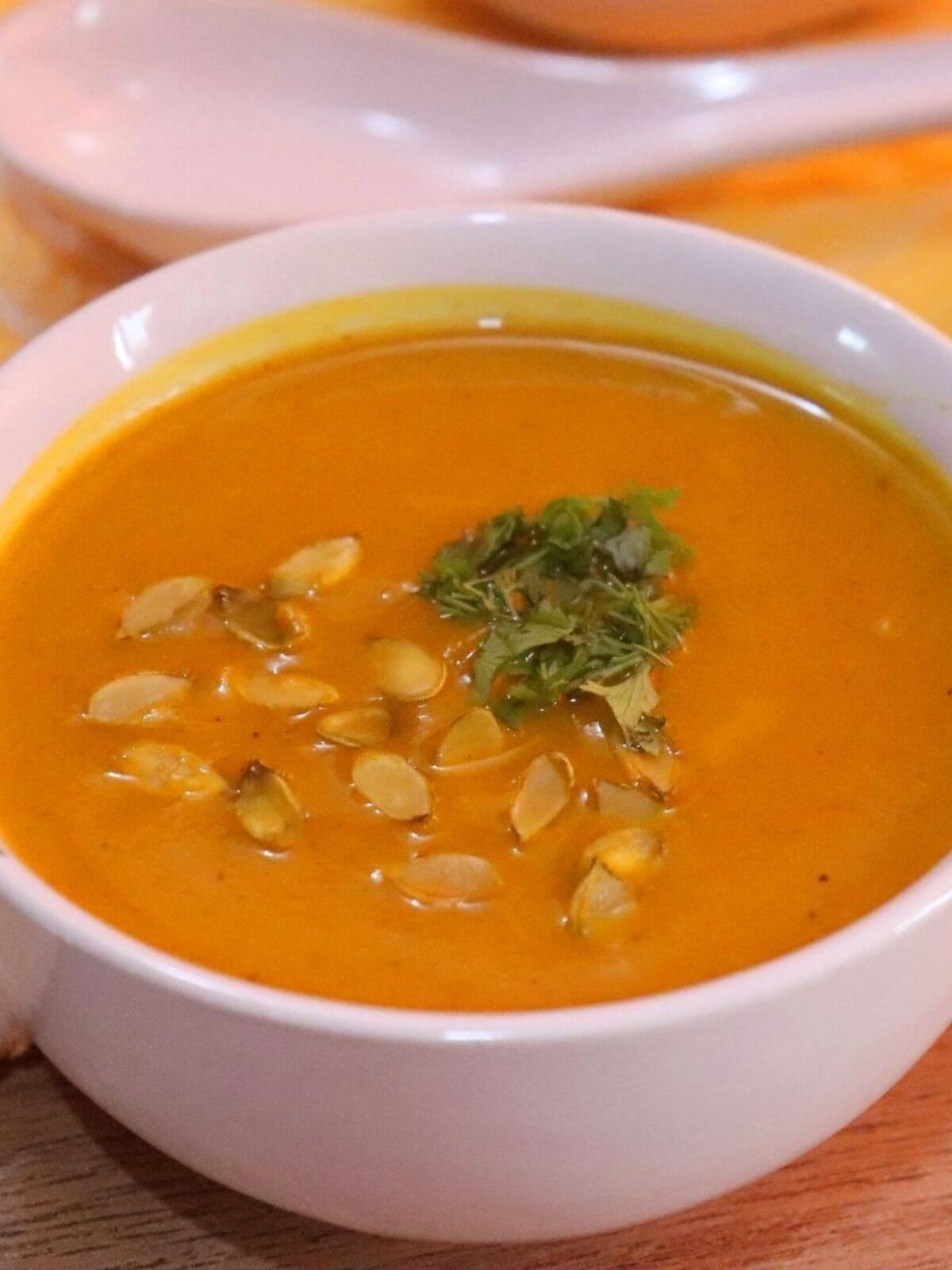 close-up of roasted pumpkin soup in a bowl.
