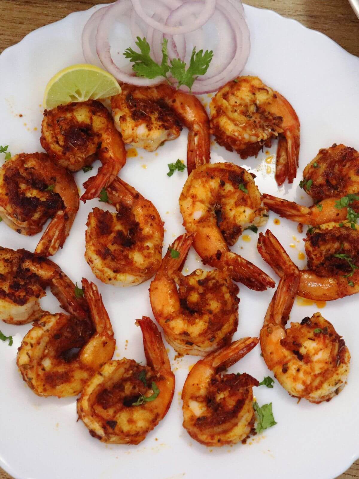 close-up of cajun shrimp served on a plate.