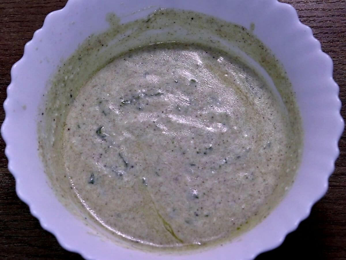 close-up of greek yogurt dressing in a bowl for making shawarma salad.