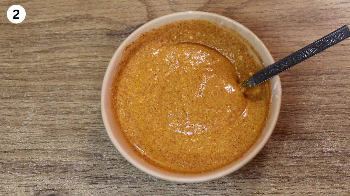 spiced yogurt mixture in a ceramic bowl for dopiaza curry