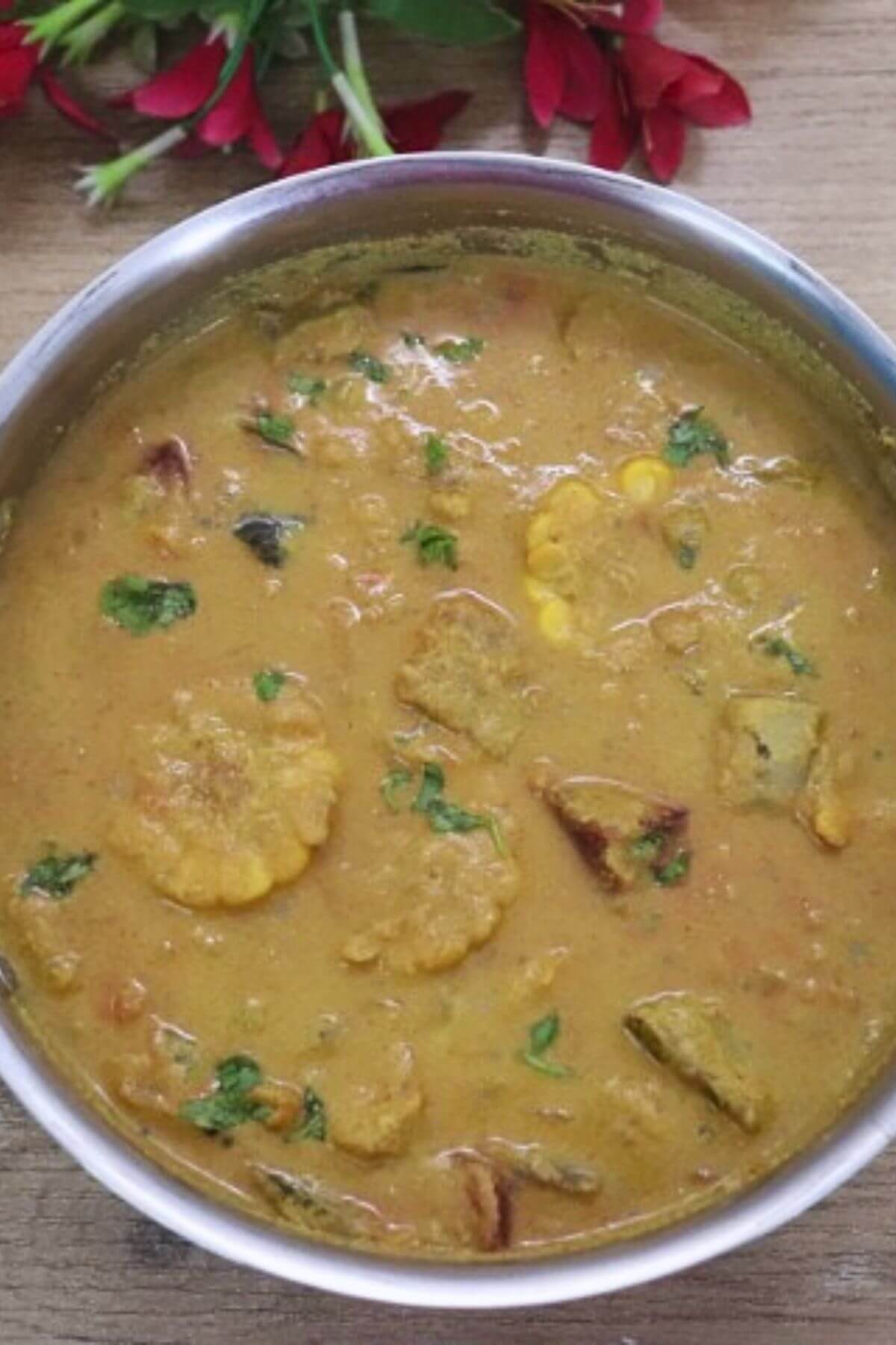goan khatkhate in a kadhai, garnished with coriander leaves.
