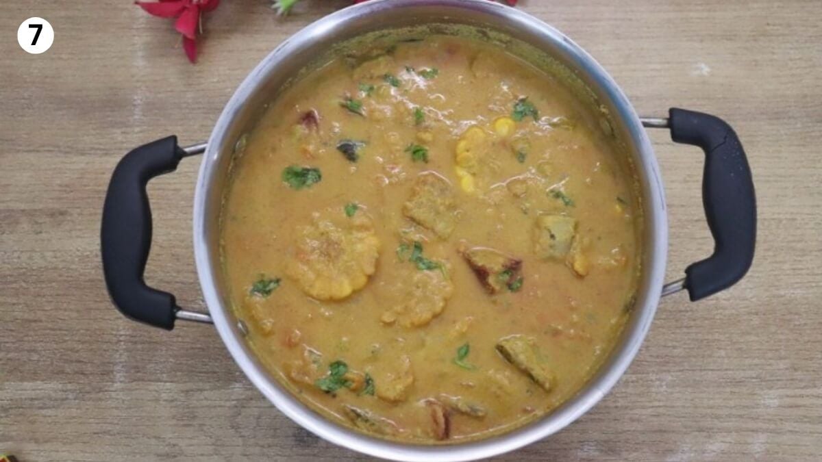 Garnishing Goan Khatkhate with coriander leaves.