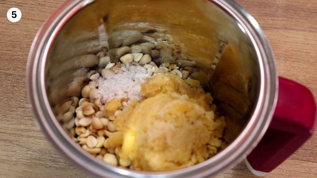 peanuts with jaggery and cardamom in a mixer.