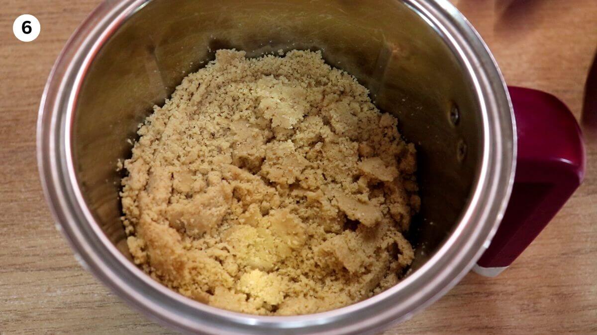 ground peanut jaggery mixture in the mixer to make peanut ladoo.