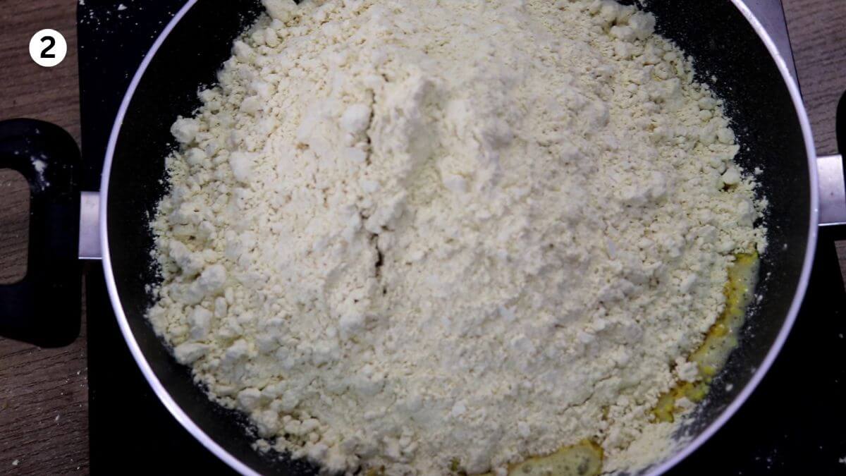 addition of besan to pan to make halwai style besan ladoo.