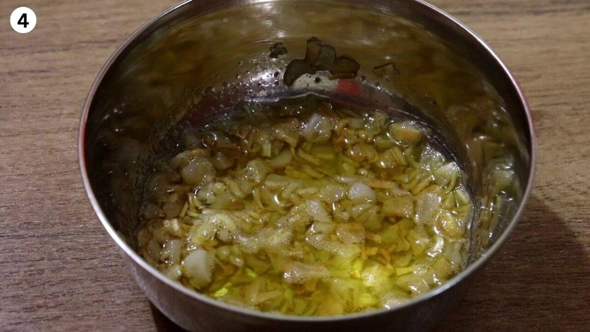 fried garlic removed in a bowl to make garlic chicken.