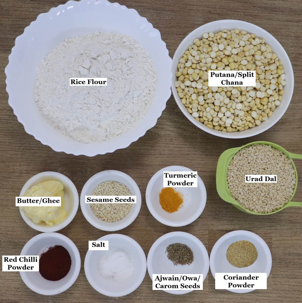 individually labelled ingredients to make Maharashtrian bhajani chakli are laid out on a table.