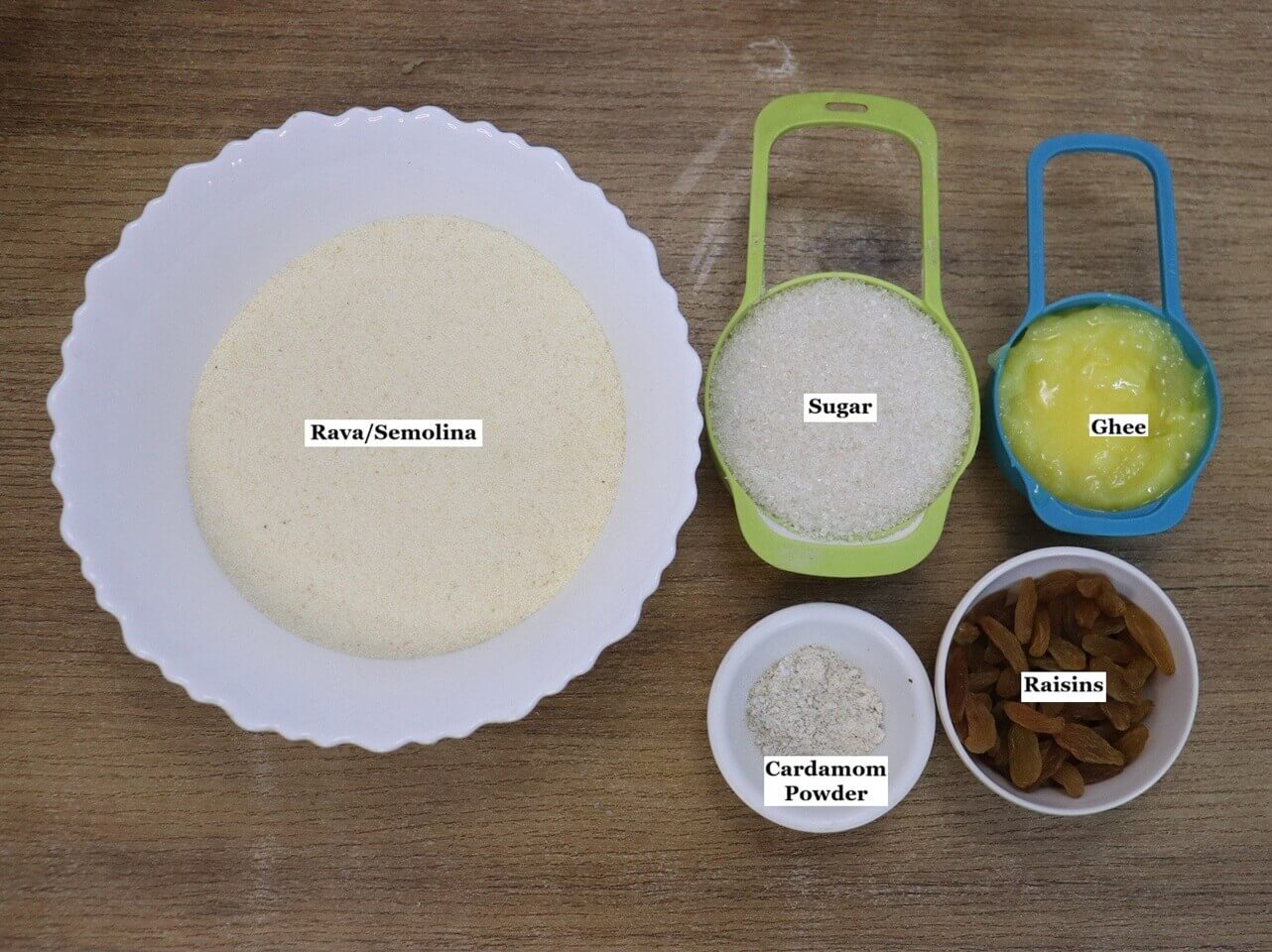 Individually labelled ingredients to make rava ladoo recipe.