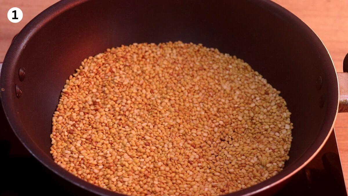 roasting moong dal to make ladoo.