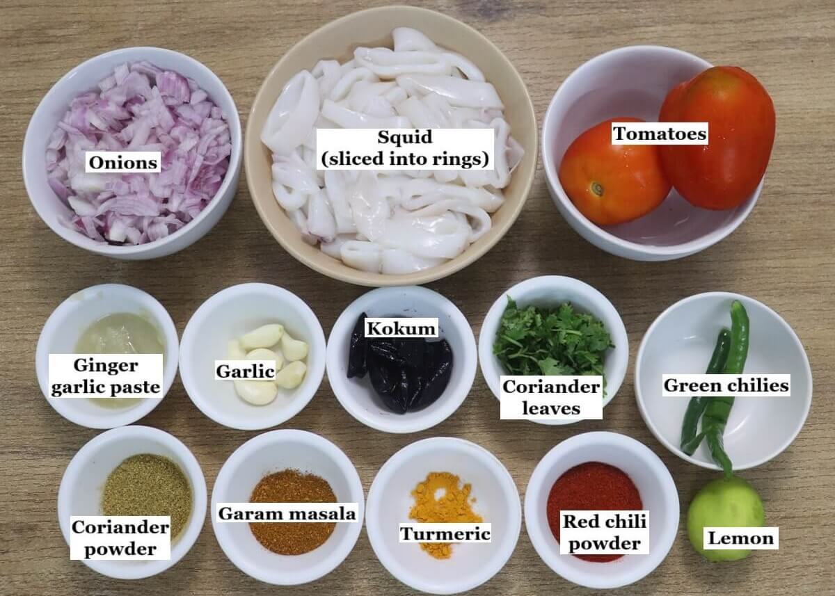 individually labelled ingredients to make squid masala are laid out on a table.