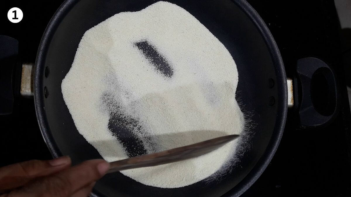 roasting rava to make suji ke gulab jamun.