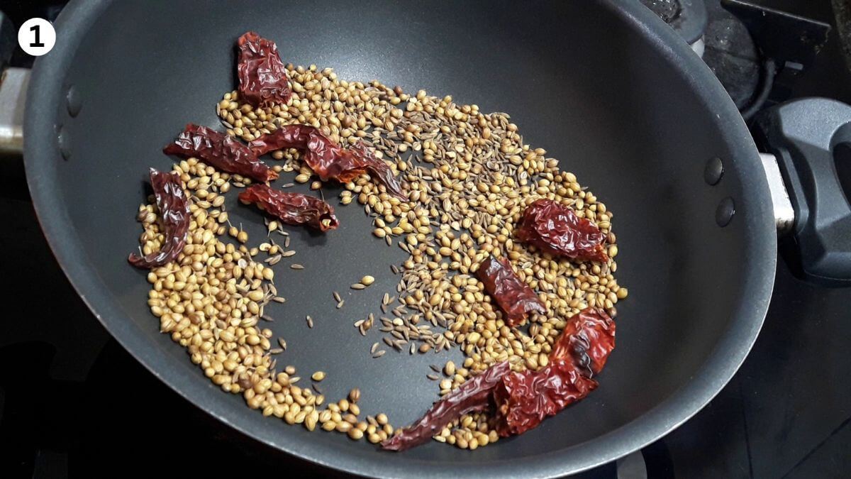 roasting spices to make hyderabadi chicken masala.