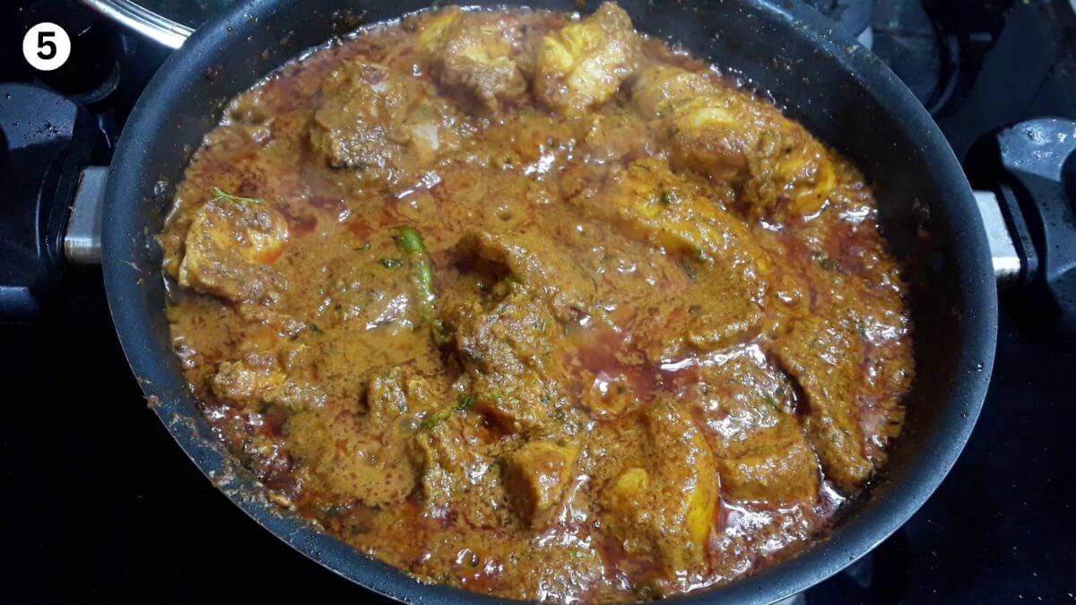 cooking marinated chicken for making hyderabadi chicken curry.