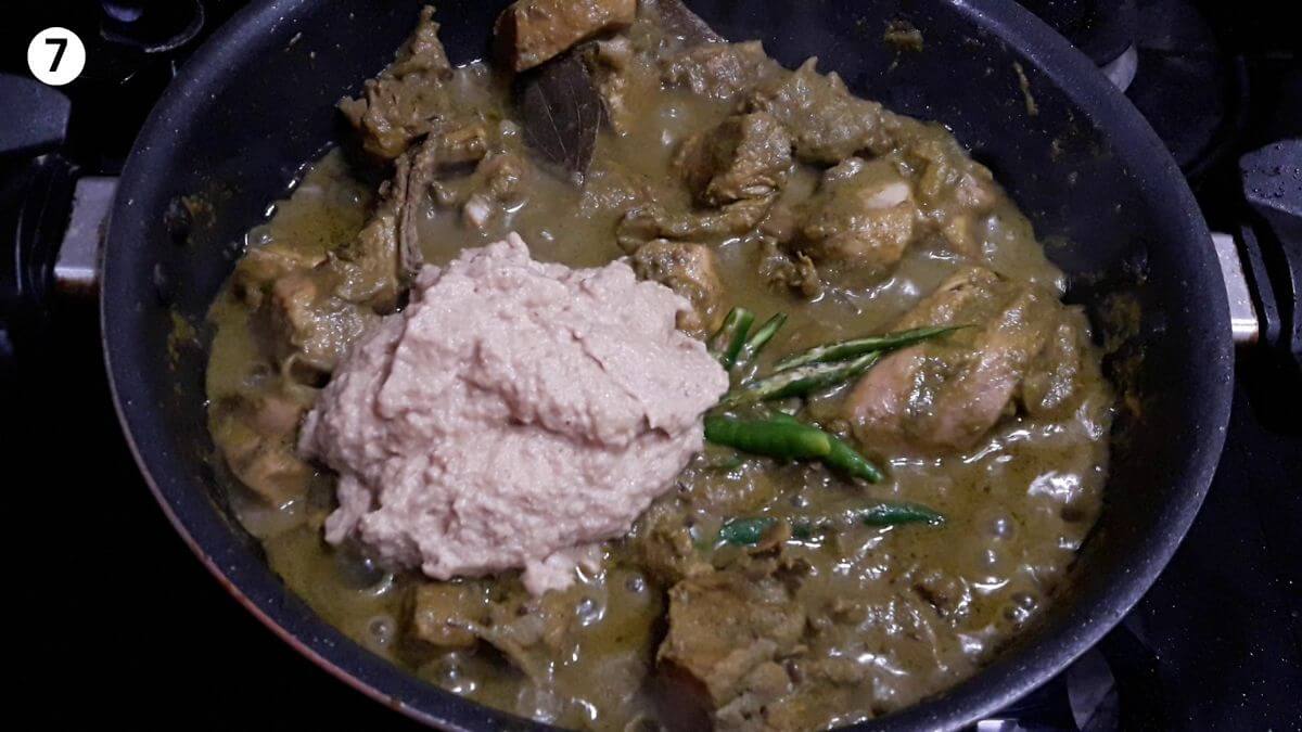 addition of onion paste and green chilies to make hyderabadi green chicken curry.