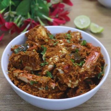 mangalorean crab sukka served in a white bowl.