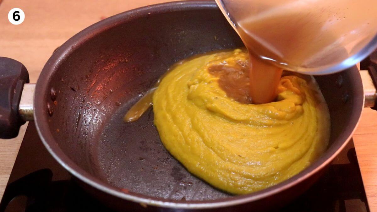 addition of roasted pumpkin puree and the liquid to the pan.