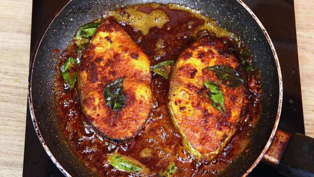 curry leaves added while frying the fish for Andhra style flavor.