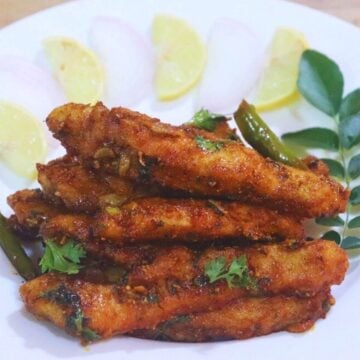 chicken majestic served on a white plate.