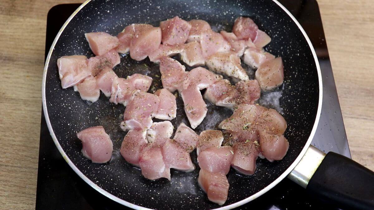 seasoning the chicken with salt, pepper and italian seasoning for making creamy chicken stew.