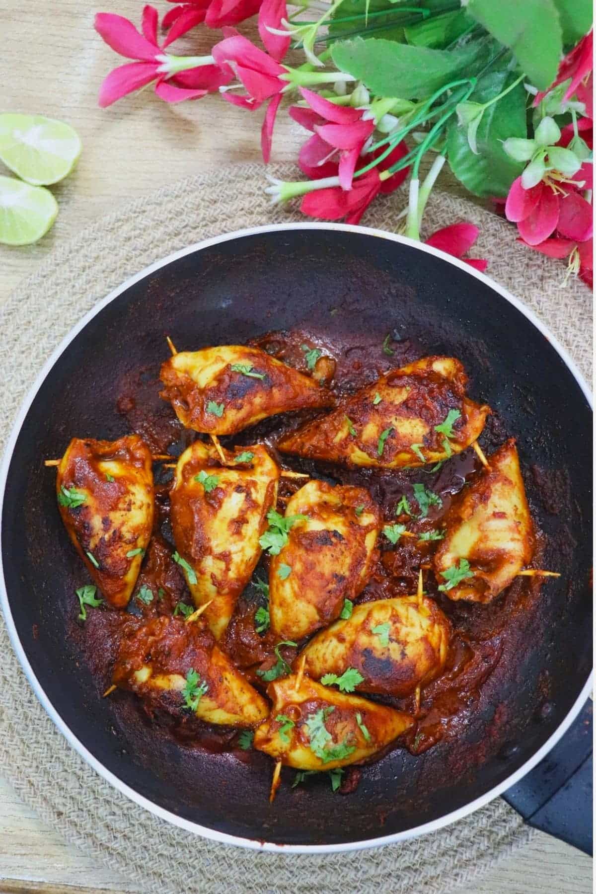 goan stuffed squids with recheado masala in a pan.