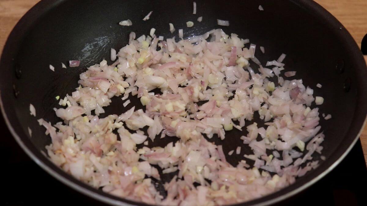 sauteing onions and garlic to make Italian minestrone soup recipe.