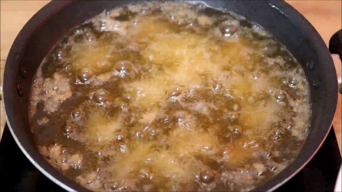 frying popcorn chicken in hot oil.